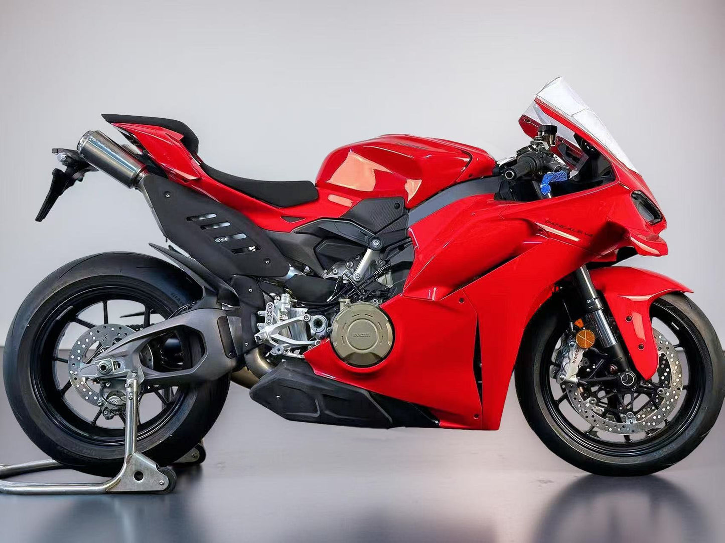 2025 Ducati Panigale Red sports motorcycle on a grey background