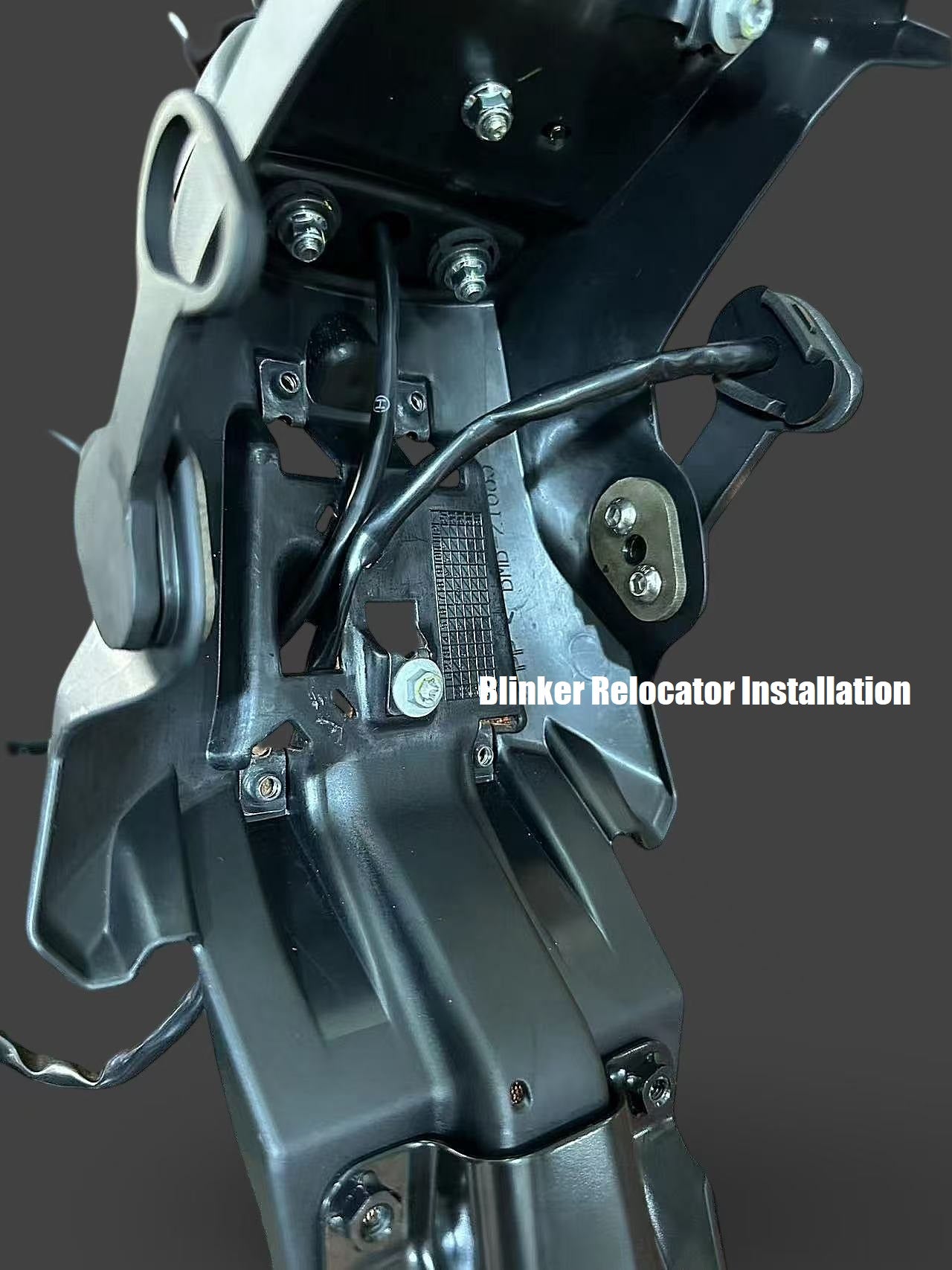 A Close up image of a motorcycle's blinker relocator.
