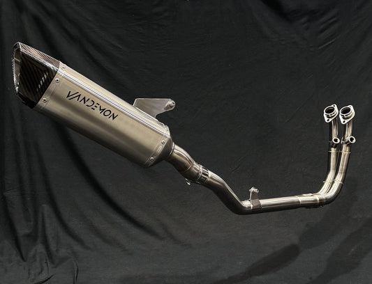 vandemon brushed stainless steel exhausts against a black backdrop.