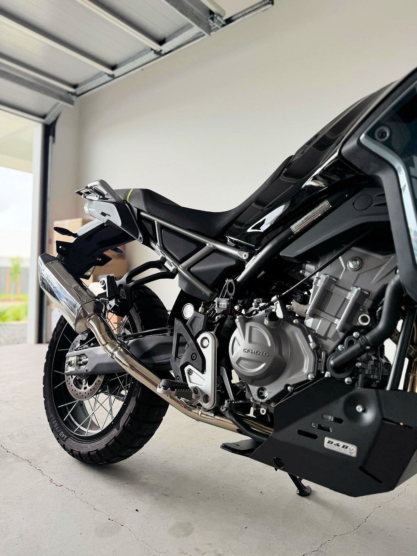 A motorcycle parked in an open garage