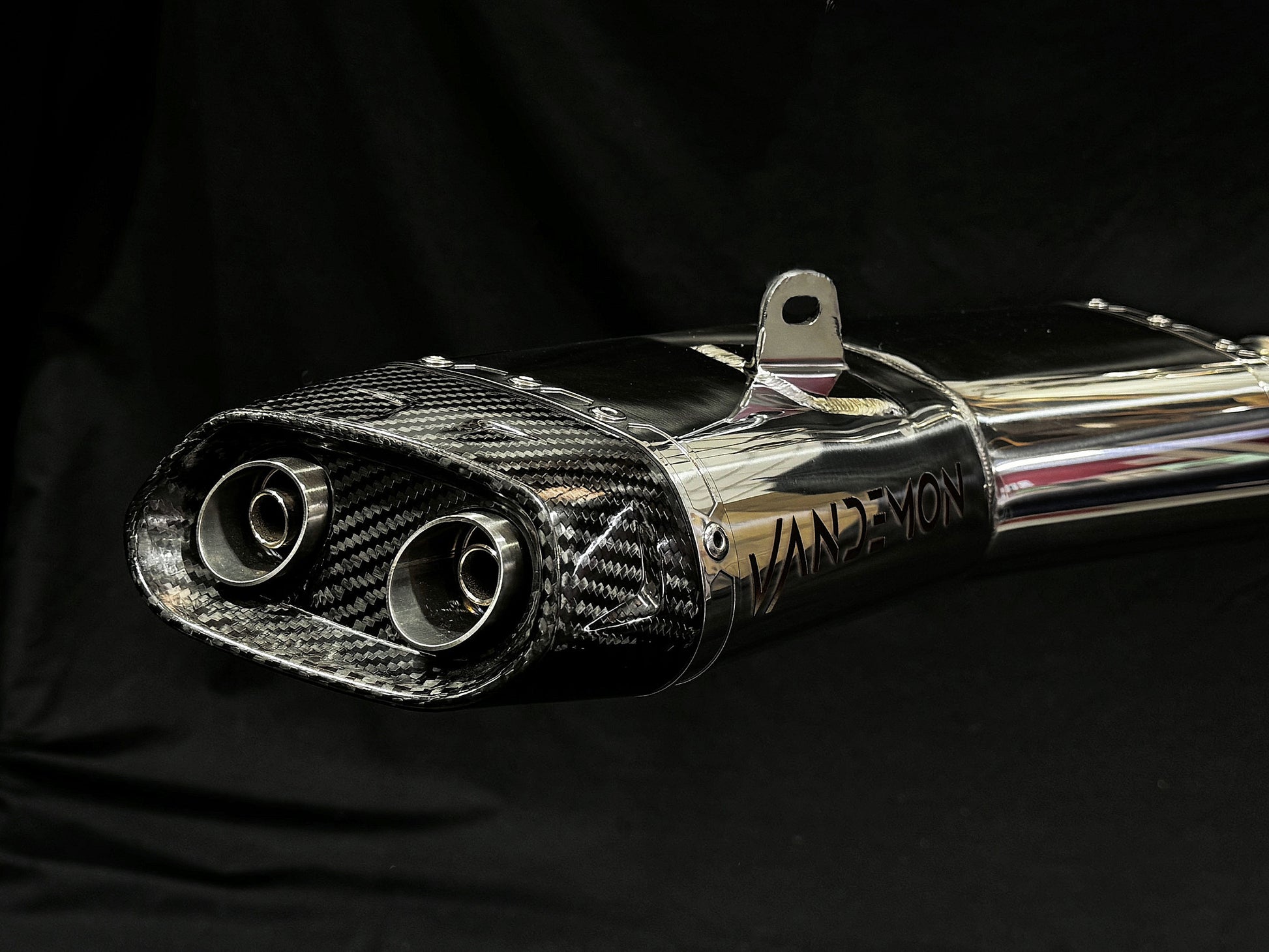 Close-up view of a carbon fiber exhaust pipe