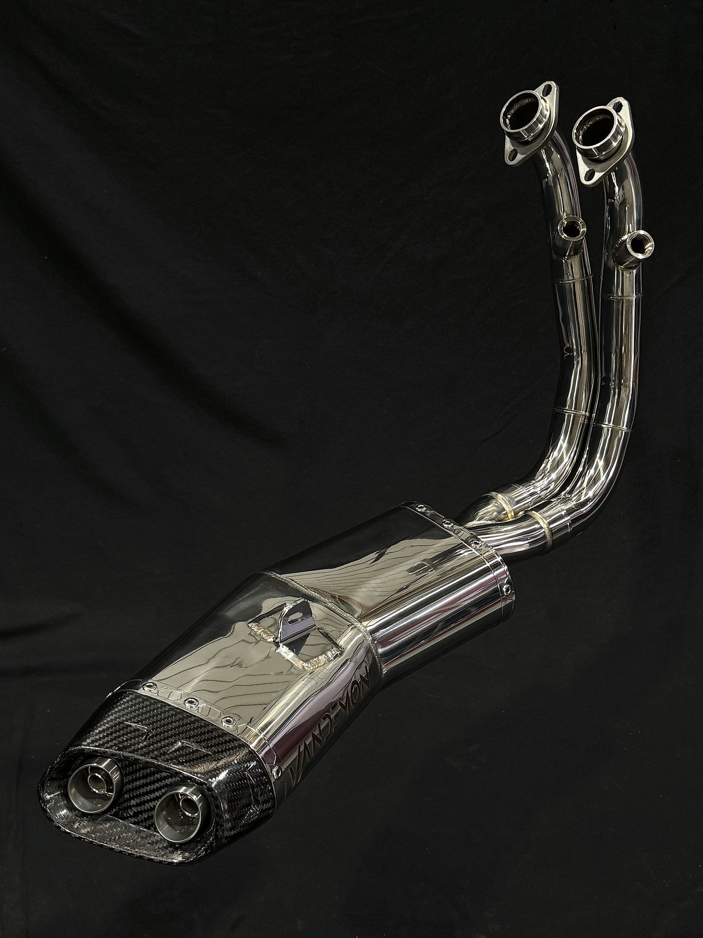 Close-up image of a carbon fiber exhaust pipe