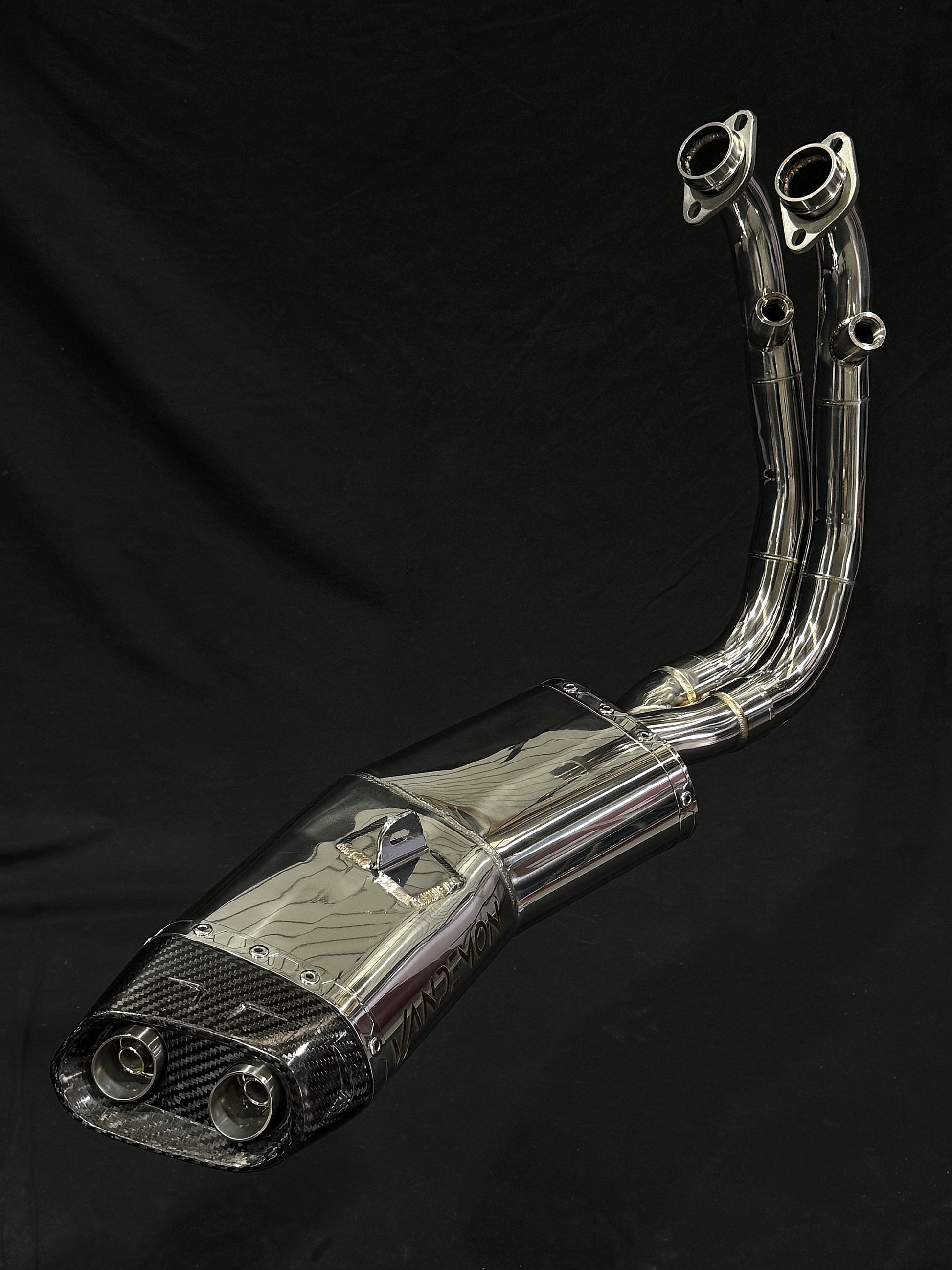 Close-up image of a carbon fiber exhaust pipe