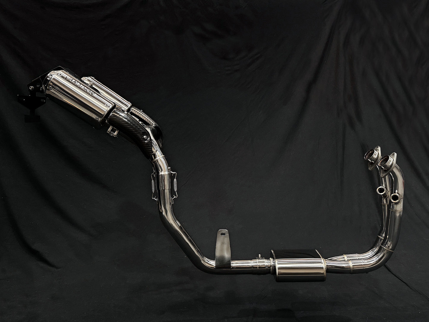 Close-up of a motorcycle featuring two prominent exhaust pipes