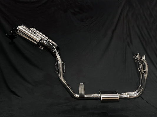 Close-up of a motorcycle featuring two prominent exhaust pipes