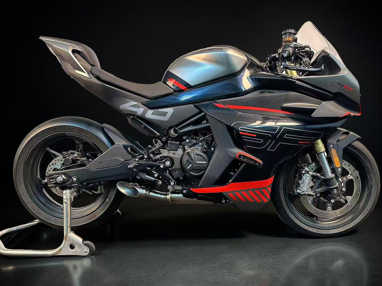 Black and red CFMOTO motorcycle with low mount Stainless Steel Exhaust