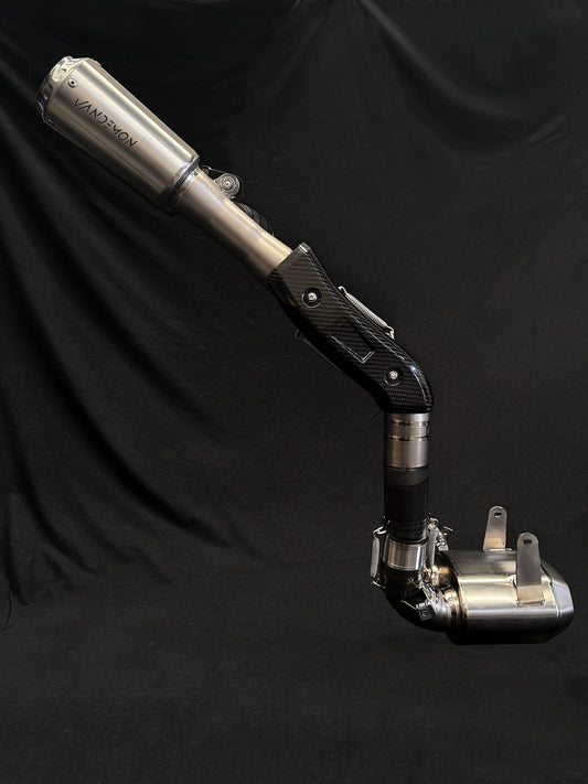 Modern dual-exhaust motorcycle system with metallic finish.