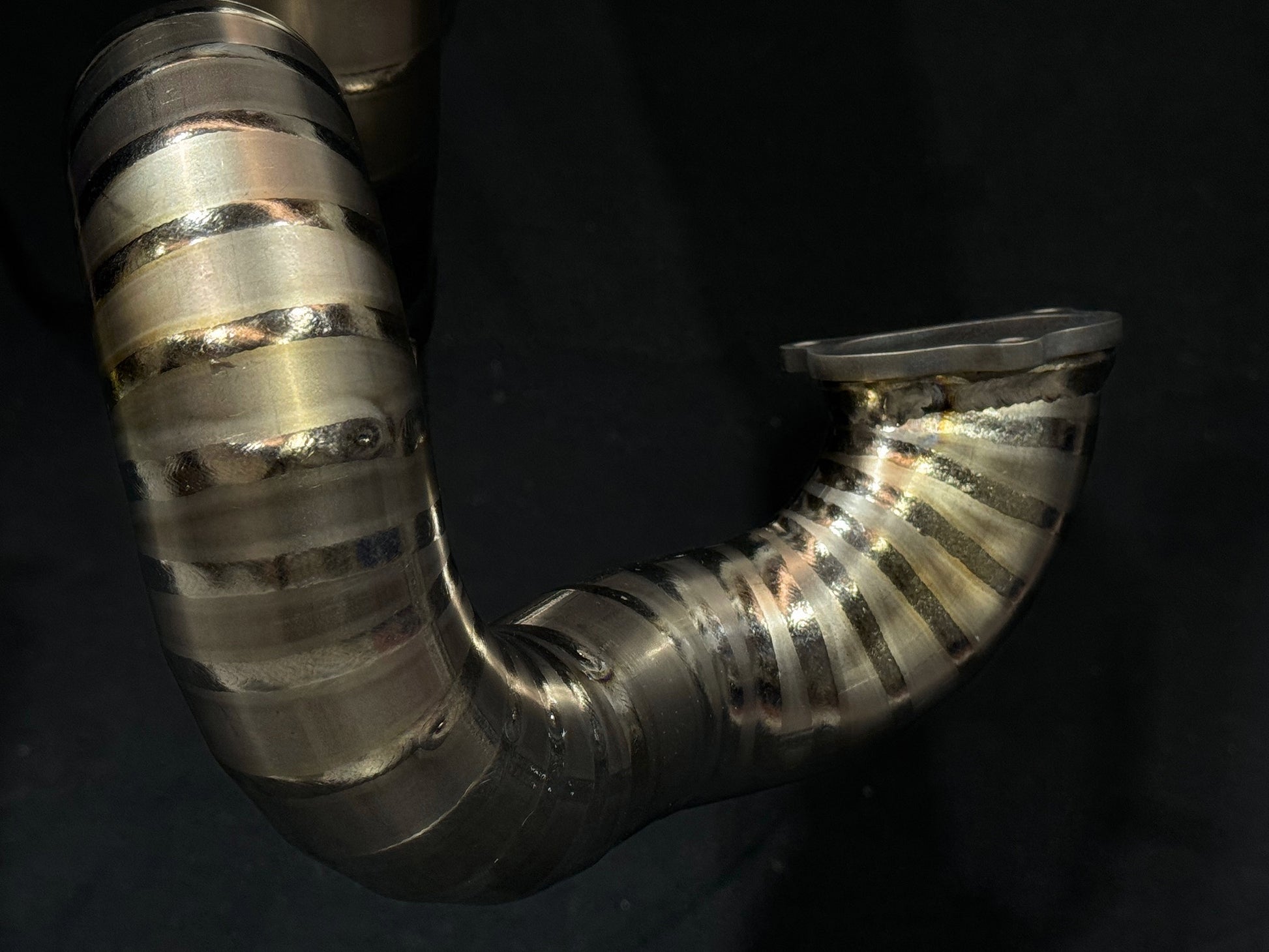 A motorcycle's titanium exhausts pie cut