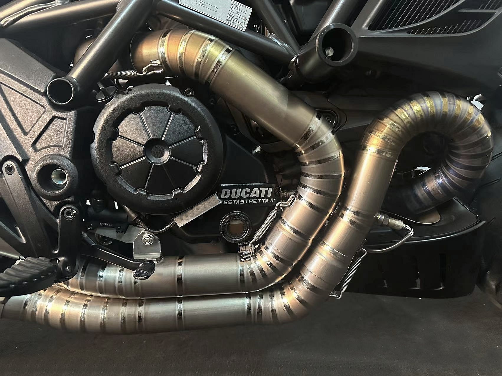 A Ducati motorcycle's split pulse titanium headers.