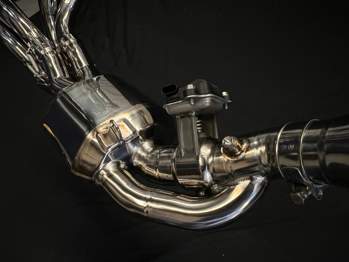 Close-up of a shiny stainless steel exhaust pipe