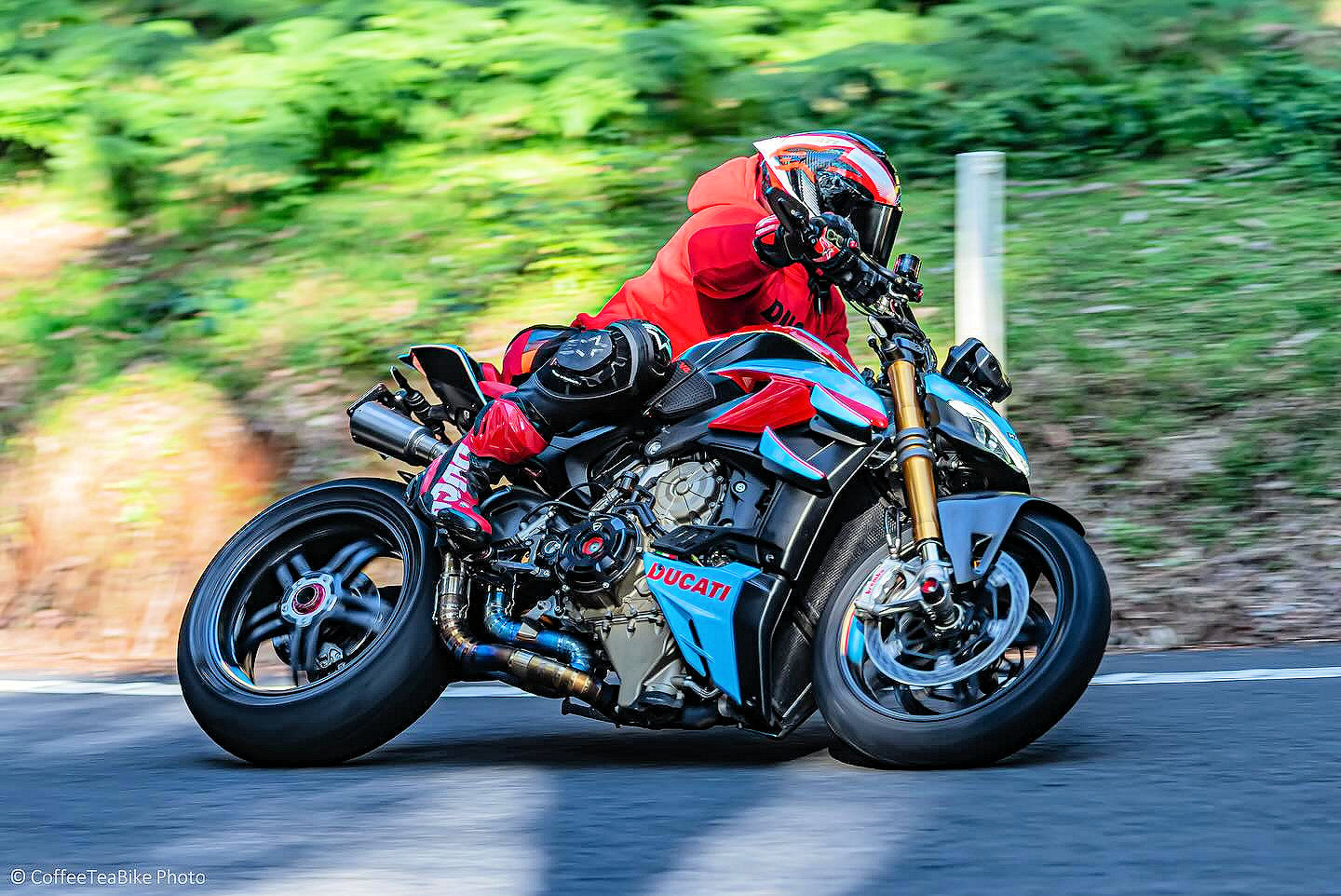 A man riding in a motorcycle participating in a race.