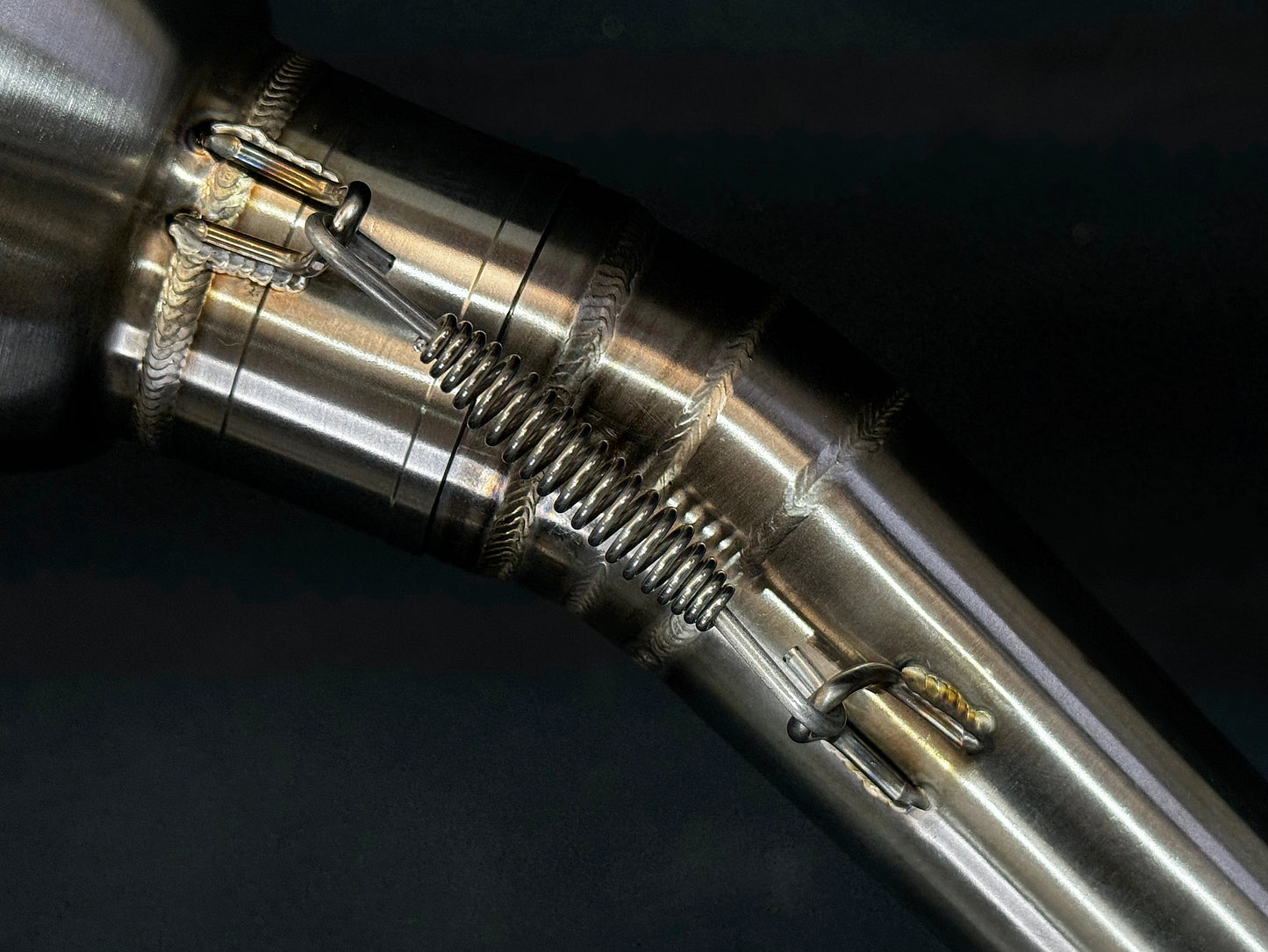 A motorcycle exhausts spring.