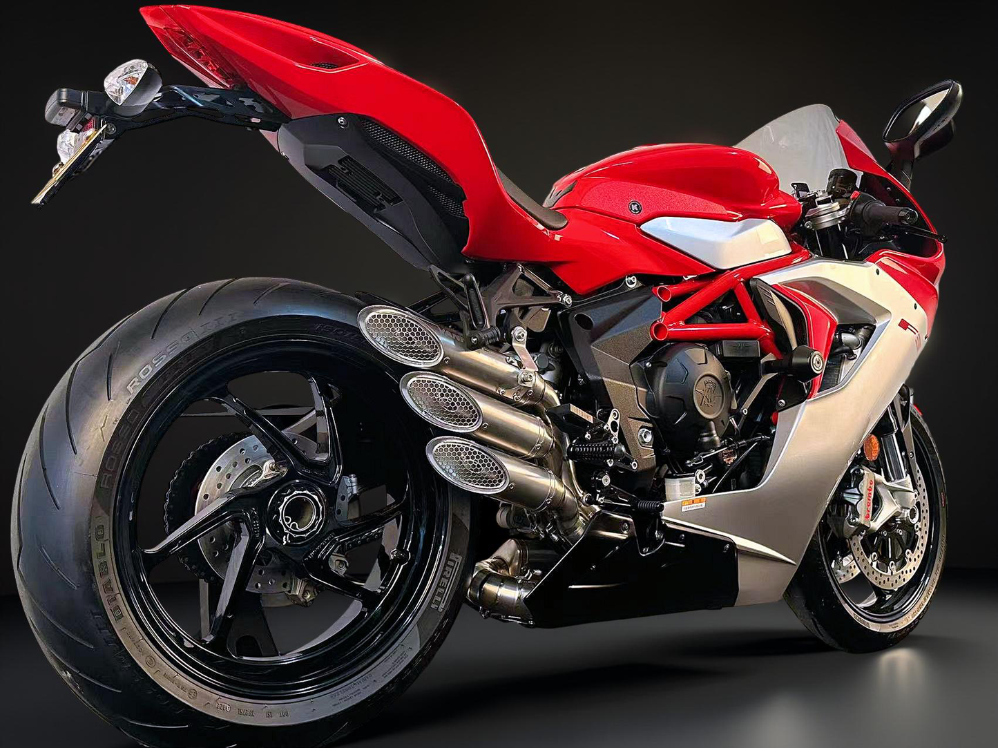 Red and black motorcycle on a dark background
