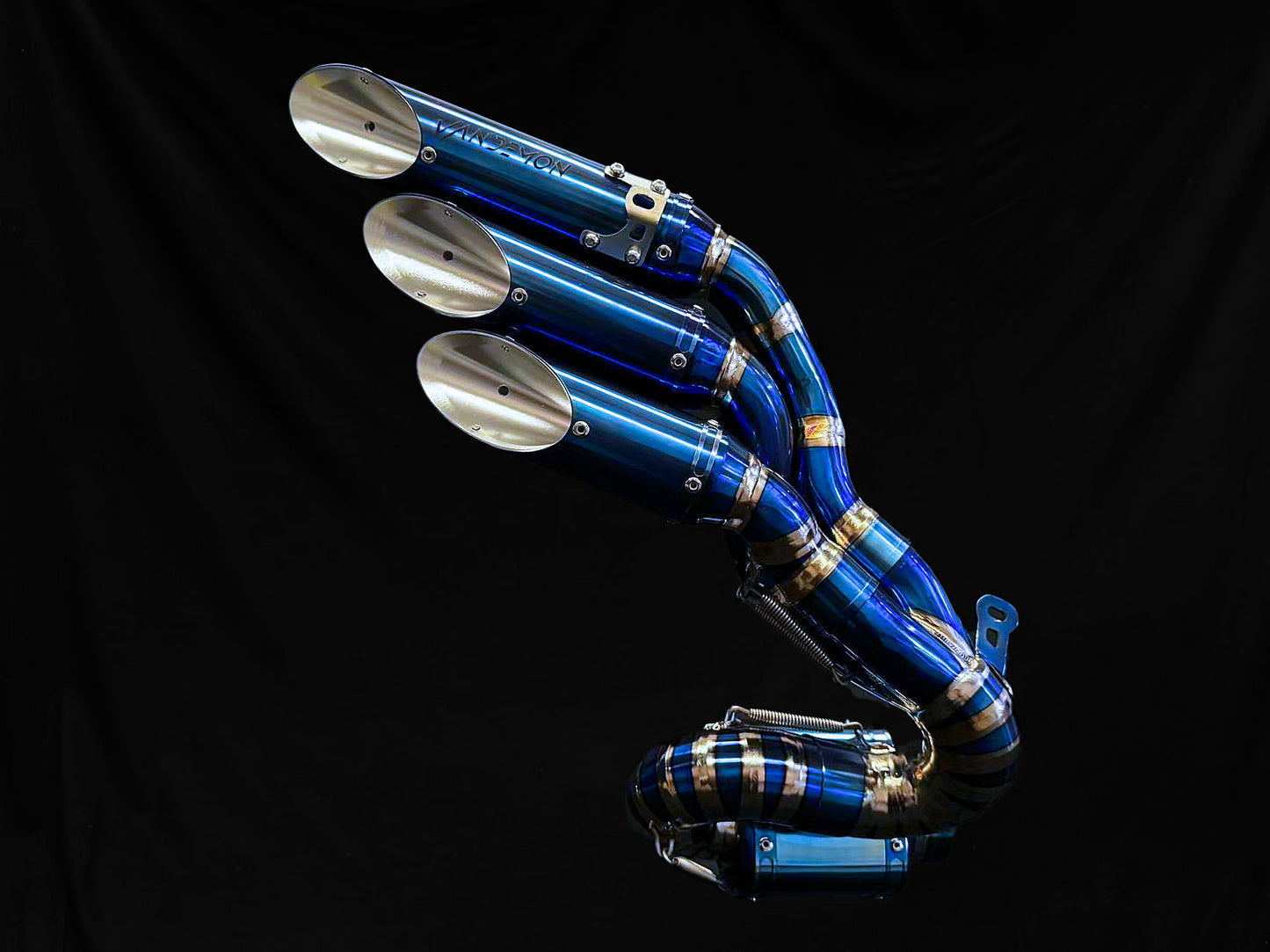 A Close up view of a blue motorcycle exhausts