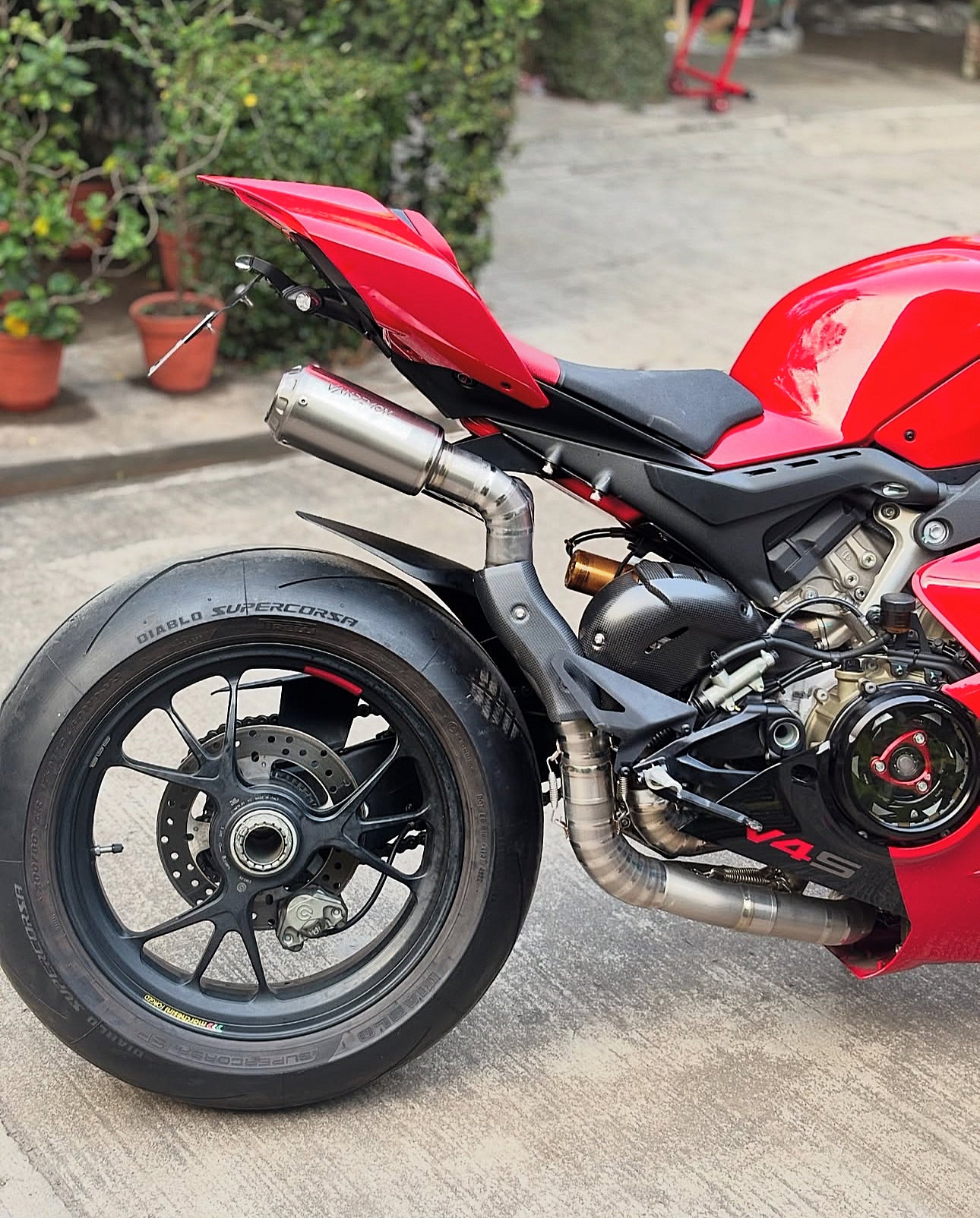 Close-up of a red sport motorcycles rear section.