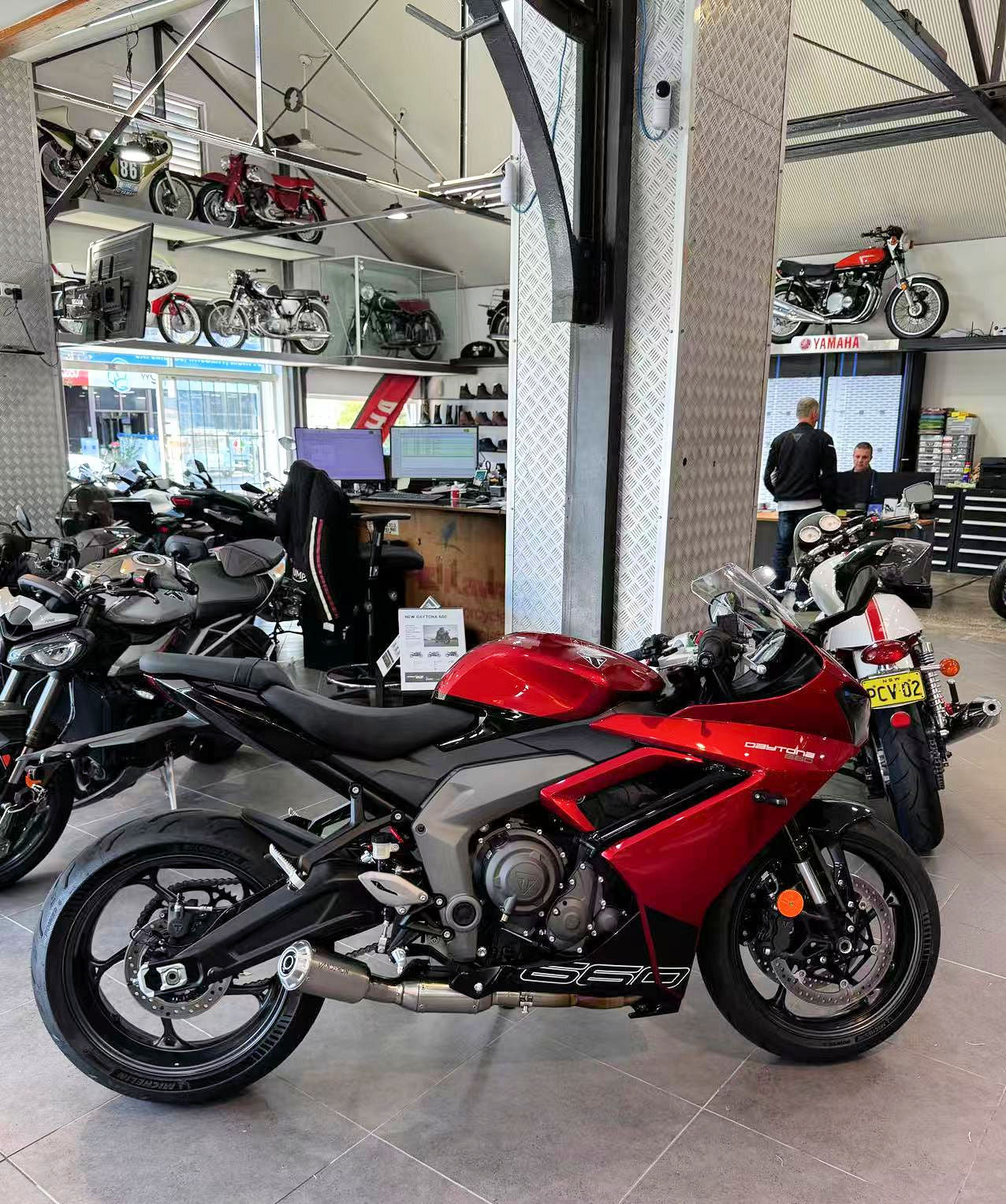 bunch of motorycles parked indoors