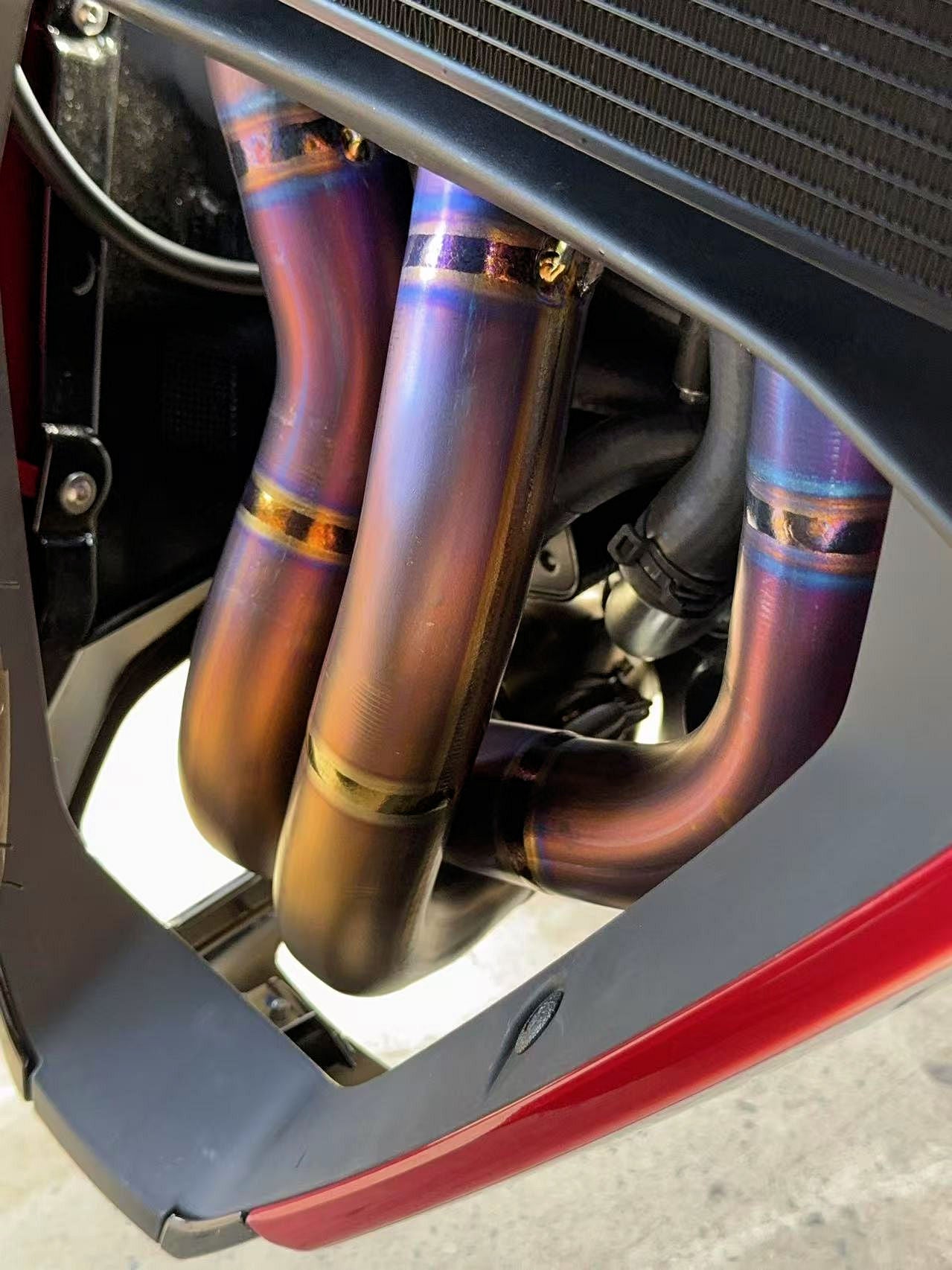 Detailed close-up of a motorcycle exhaust pipe