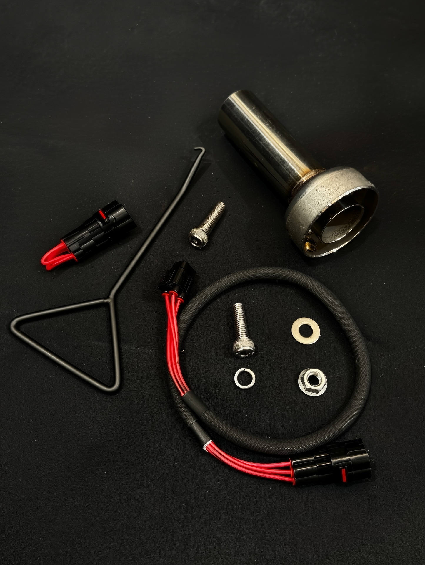 Mechanical parts and wiring on a black background