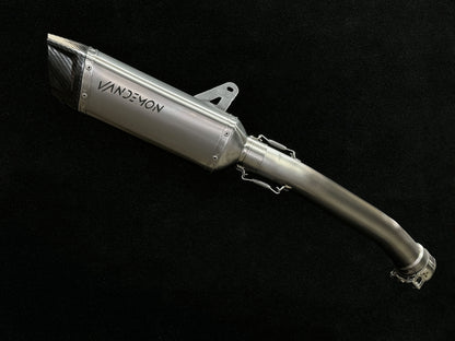 Titanium Muffler and link Pipe on a black backdrop.