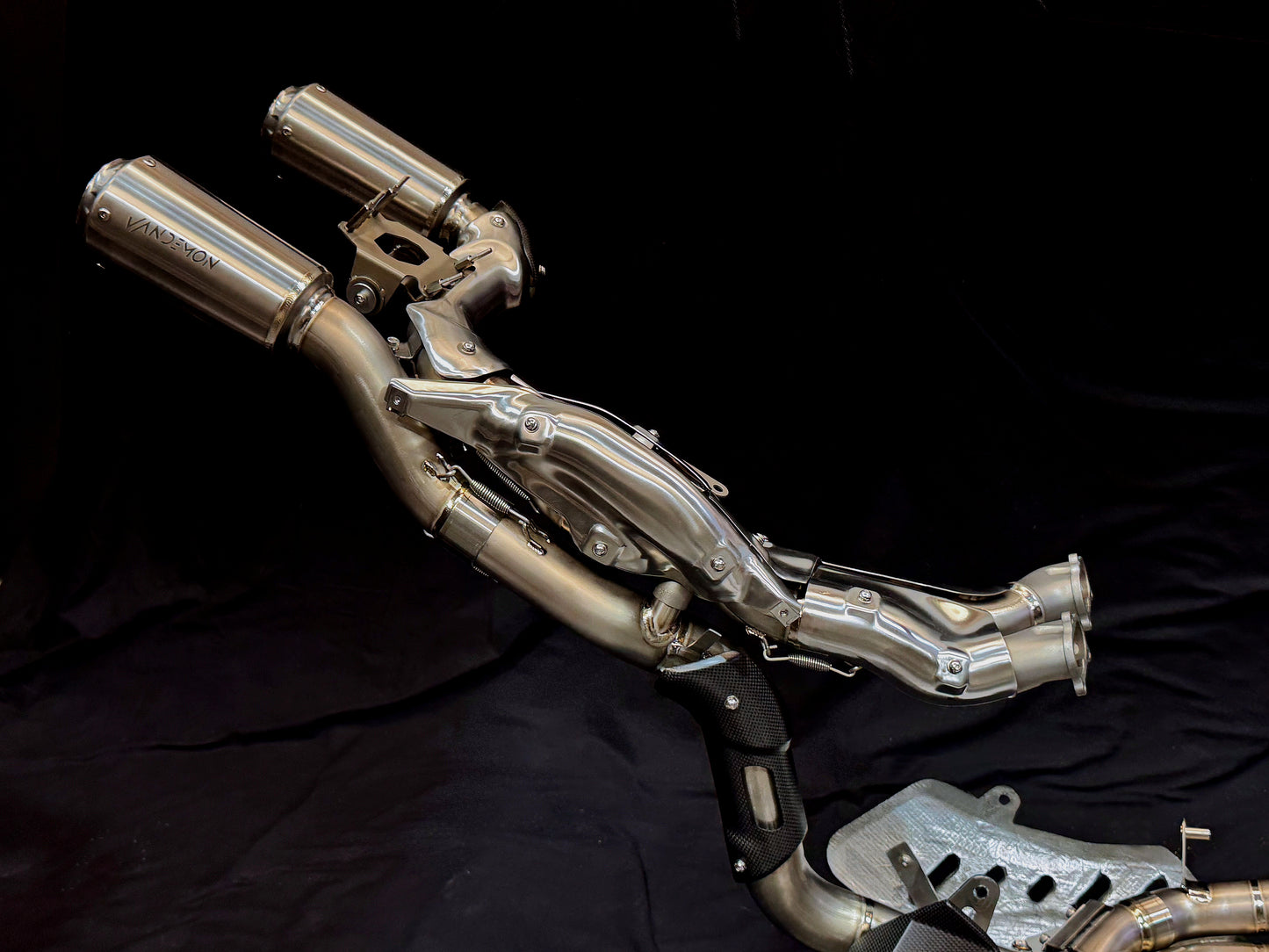 Motorcycle exhaust system on a black background