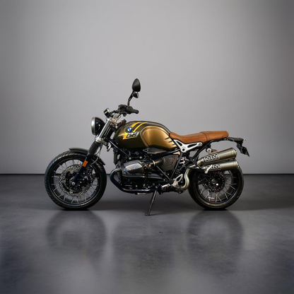 Gold and black BMW motorcycle with brown seat on a grey background