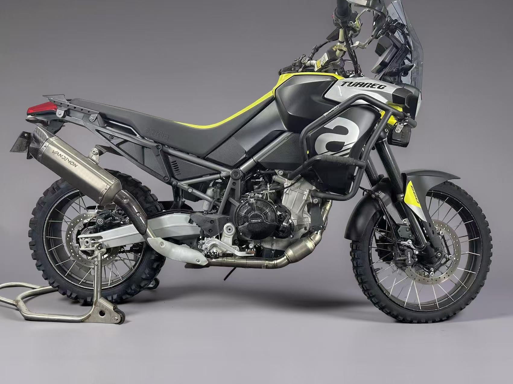 Motorcycle on a stand against a grey background