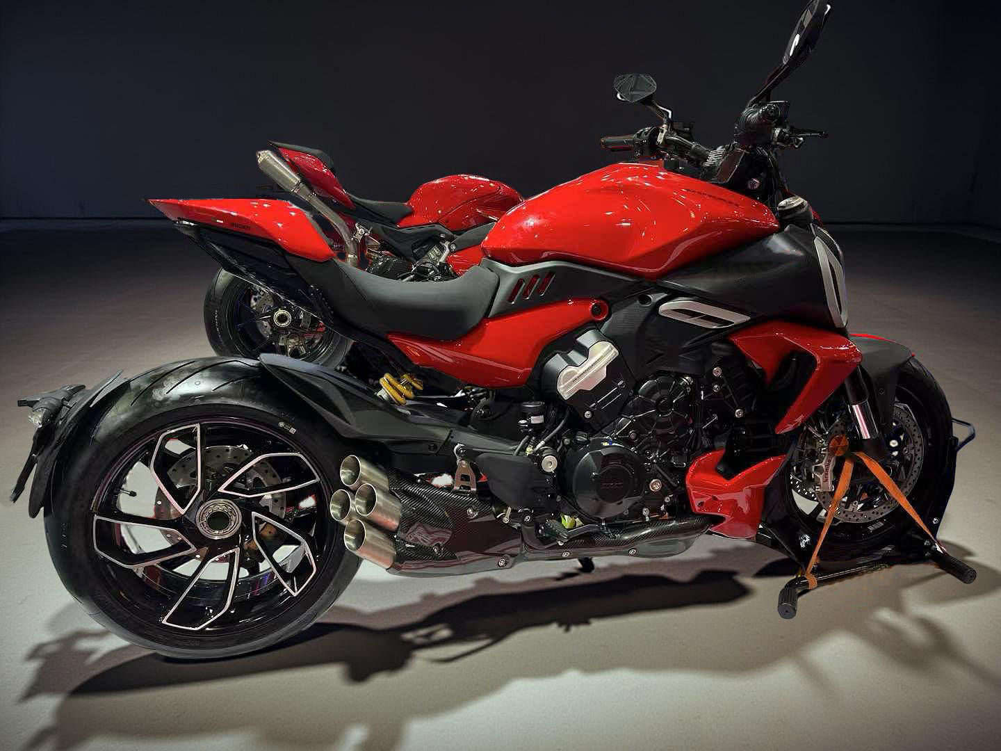 Red and black motorcycle on a dark background
