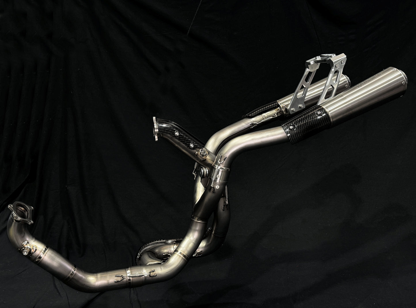 A motorcycle's high mount titanium exhausts system.