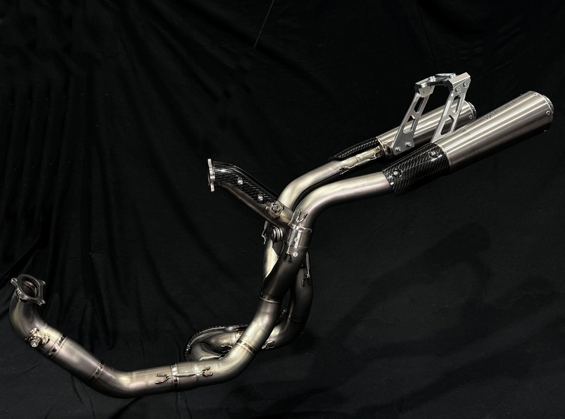 A motorcycle's high mount titanium exhausts system.