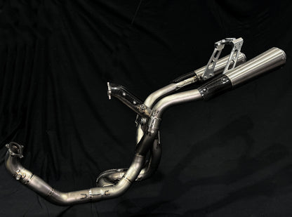 A motorcycle's high mount titanium exhausts system.