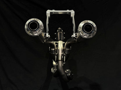 A motorcycle's high mount titanium rear mufflers.