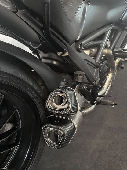 A Ducati motorcycle's split pulse titanium mufflers baffles in.