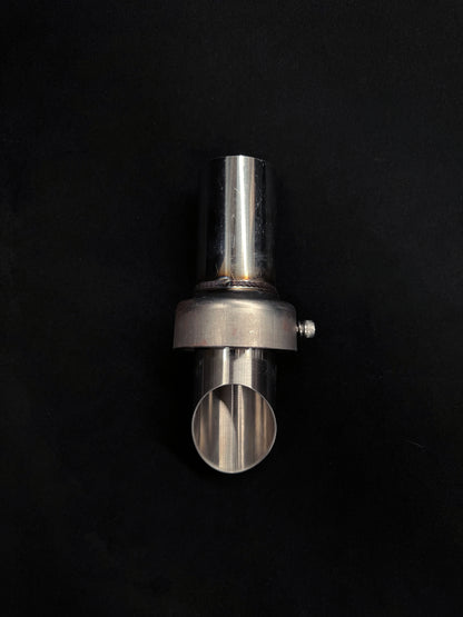 Metallic cylindrical object on a black background