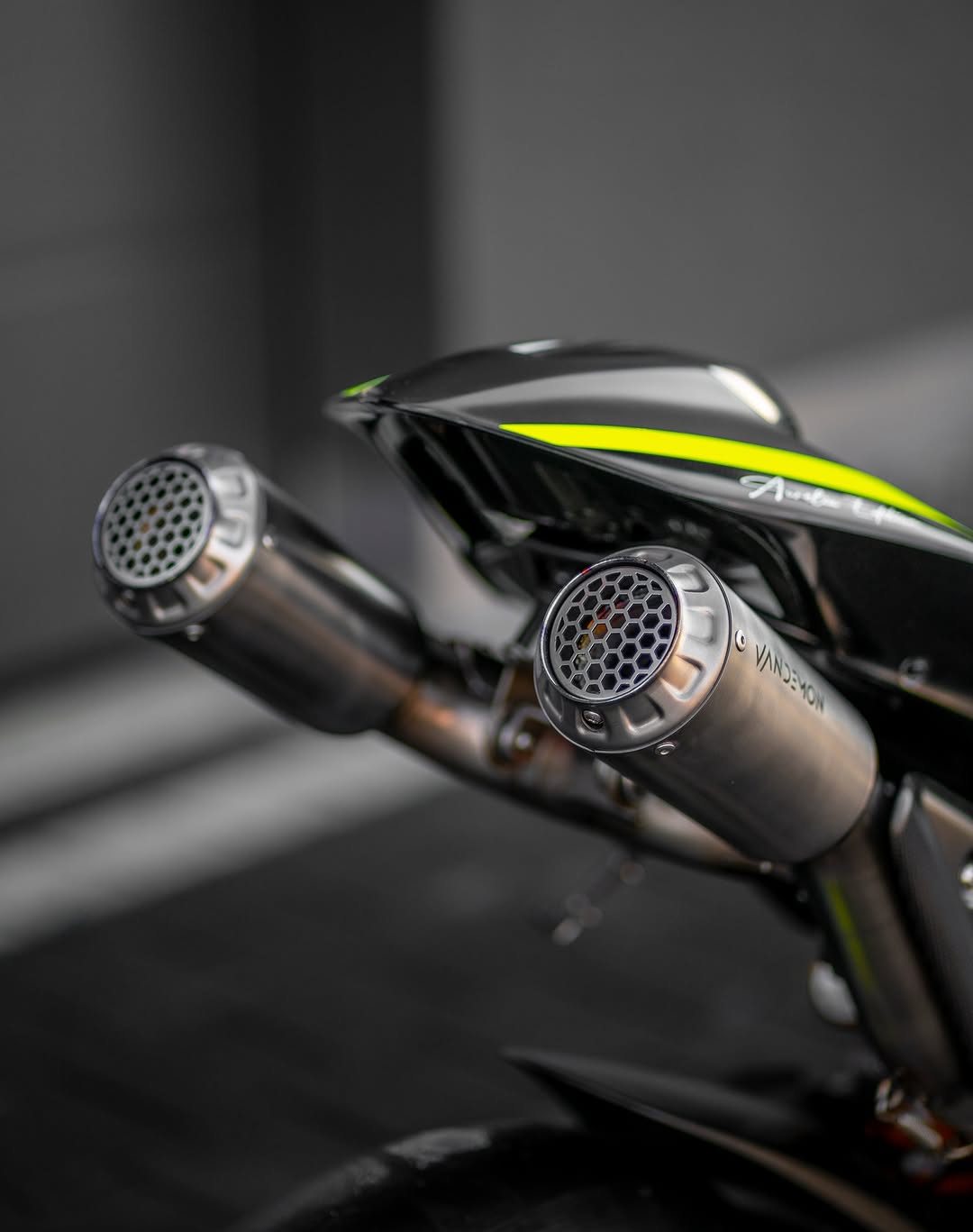 Close-up of a motorcycle exhaust with a blurred background