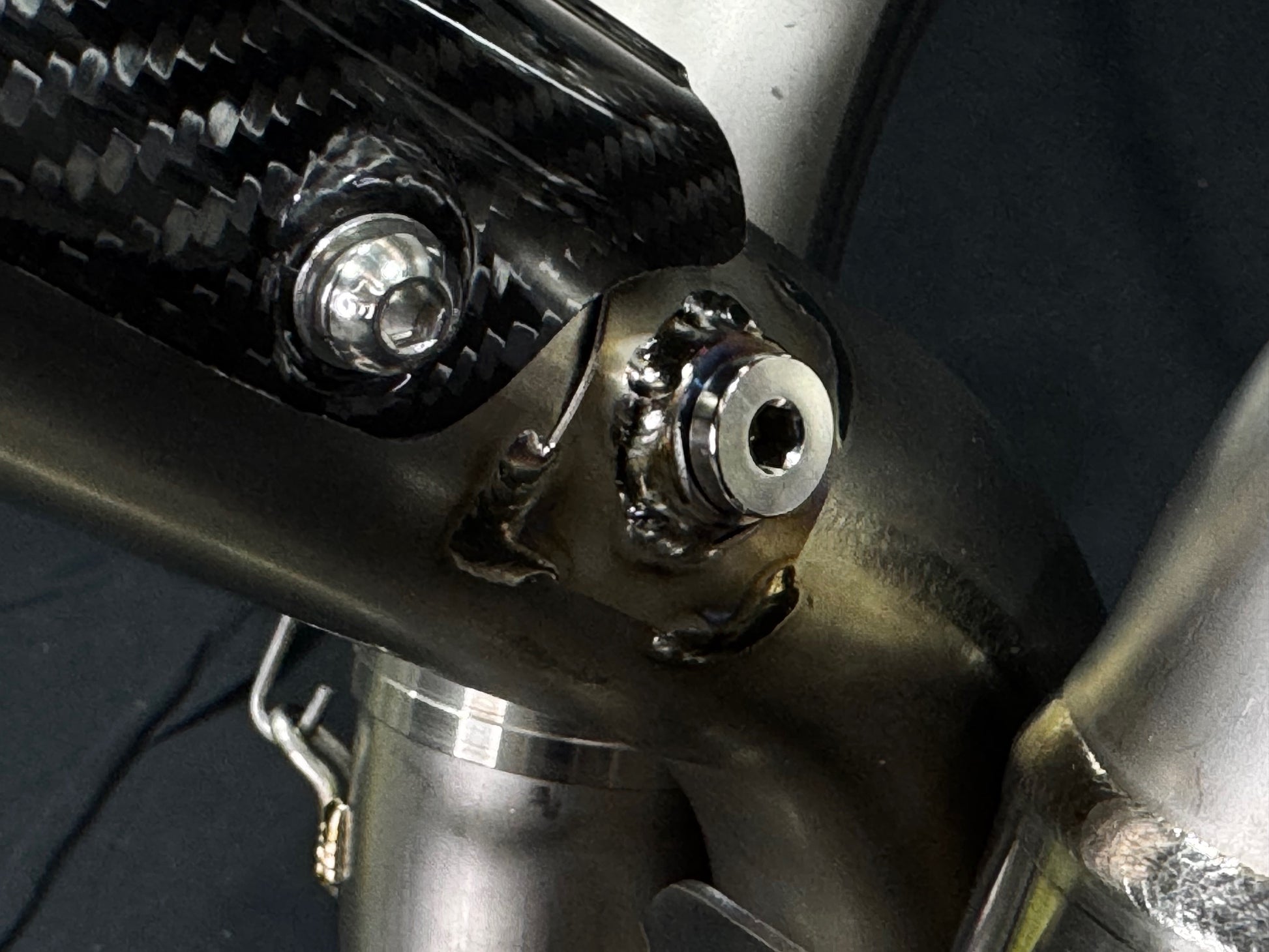 A close up view of a motorcycle's O2 plug.
