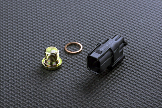 Mechanical parts including a bolt, washer, and connector on a textured black surface