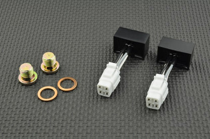 Mechanical components including connectors and washers on a grey textured background