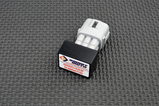 Small mechanical component with a brand label on a textured grey background