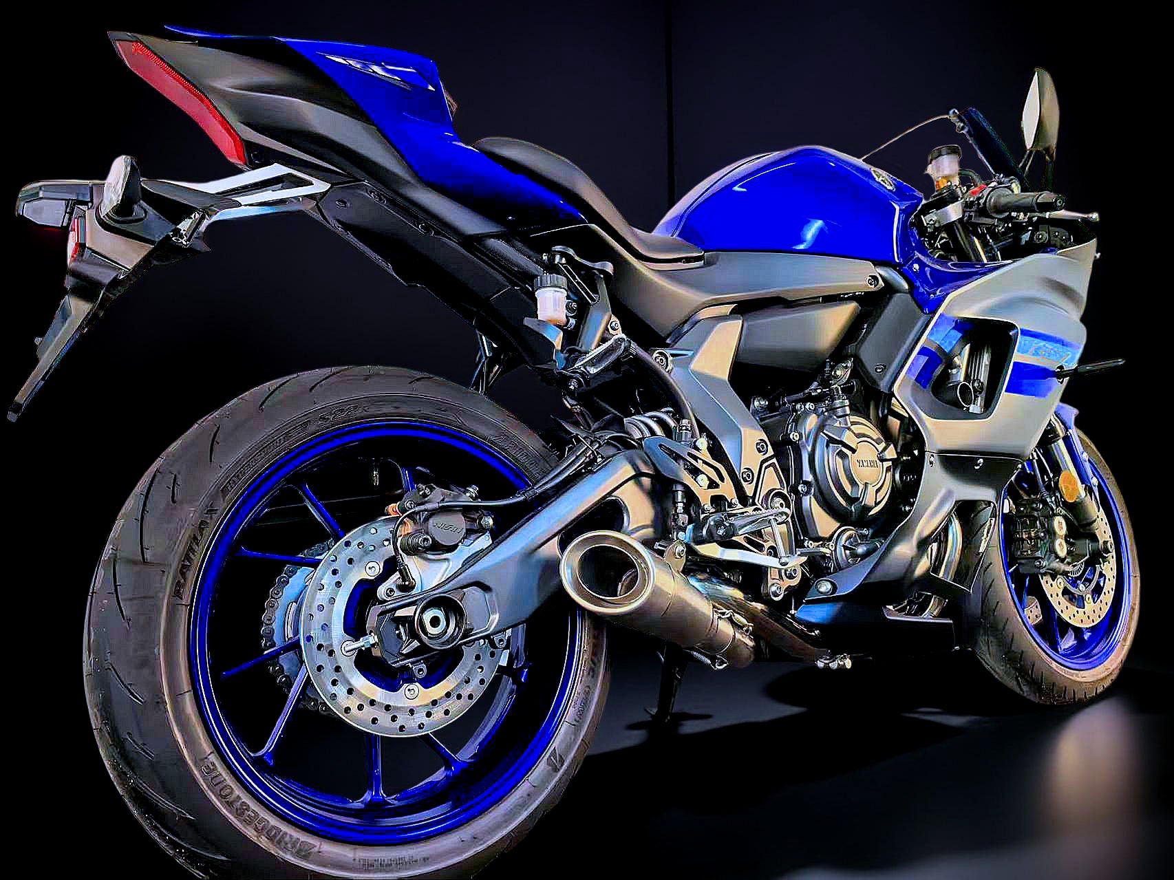Blue and black Yamaha motorcycle on a dark background