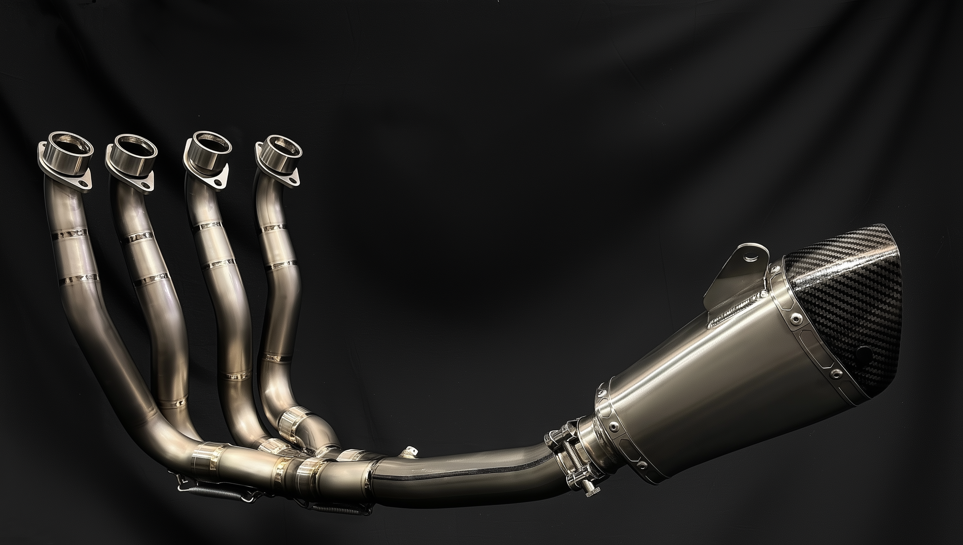 Metallic exhaust system on a black background