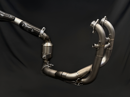 Metal exhaust pipe system on a black background