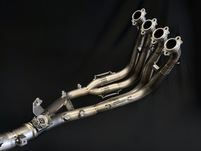 Metallic exhaust system on a black background