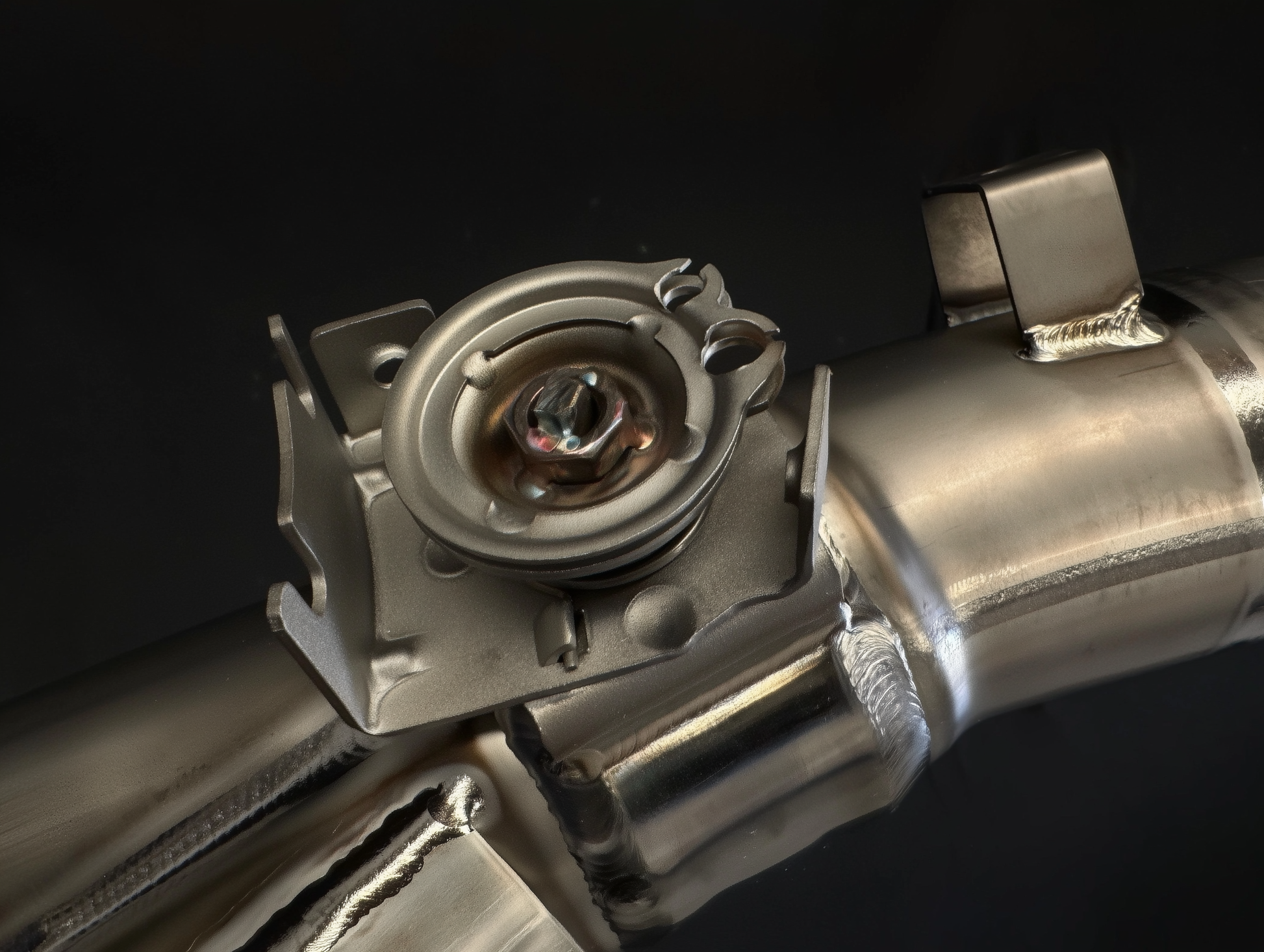 Close-up of a metallic mechanical component on a black background