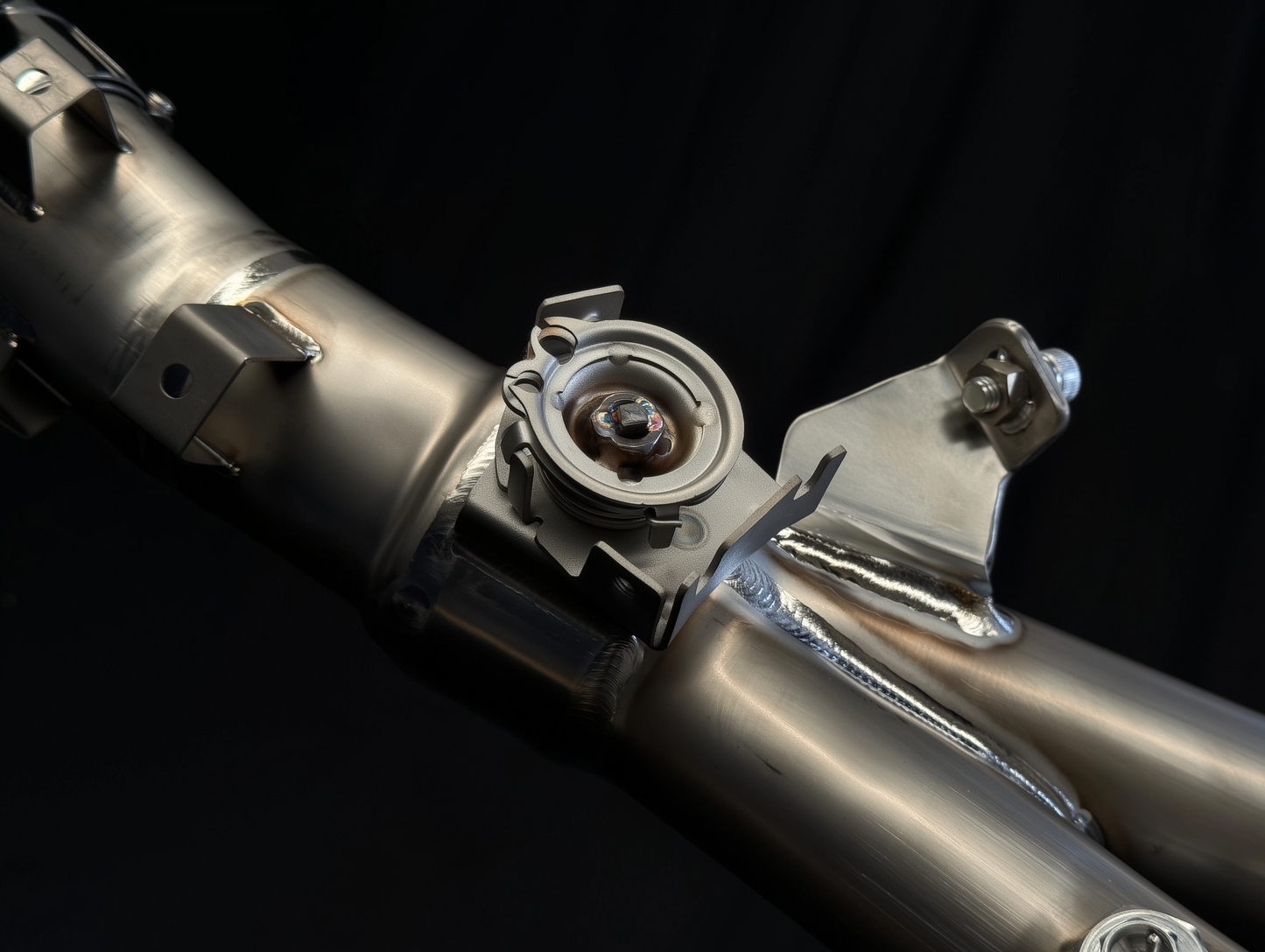 Close-up of a metallic mechanical component on a black background